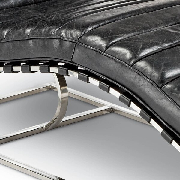 Polished nickel frame of a leather chaise lounge
